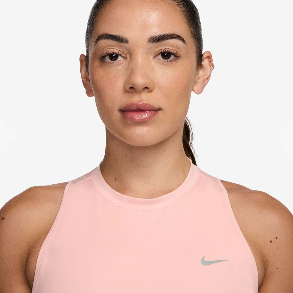 Front view of a model wearing the Nike Women's Swift Dri-FIT Running Tank Top in the Atmosphere/Reflective Silver colourway. (8620139970722)