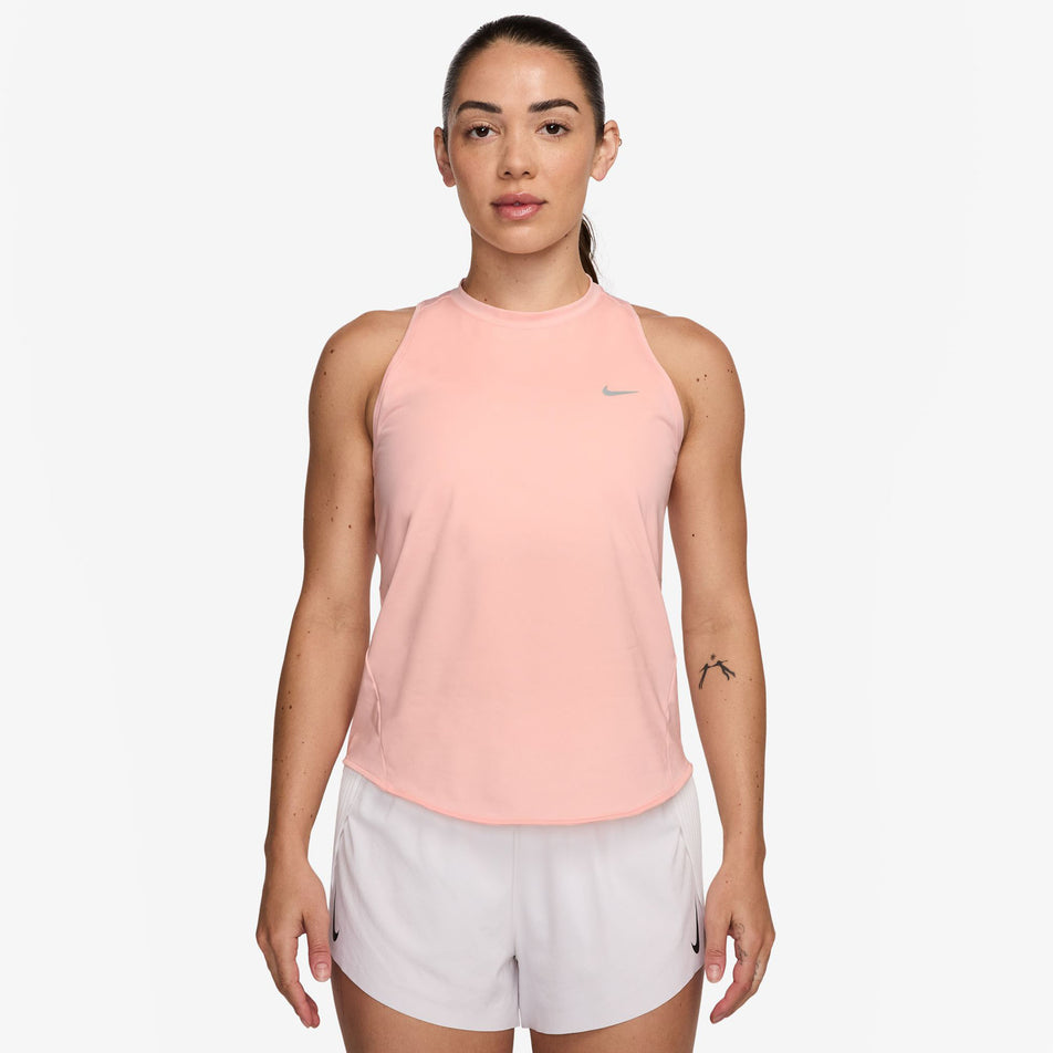 Front view of a model wearing the Nike Women's Swift Dri-FIT Running Tank Top in the Atmosphere/Reflective Silver colourway. (8620139970722)
