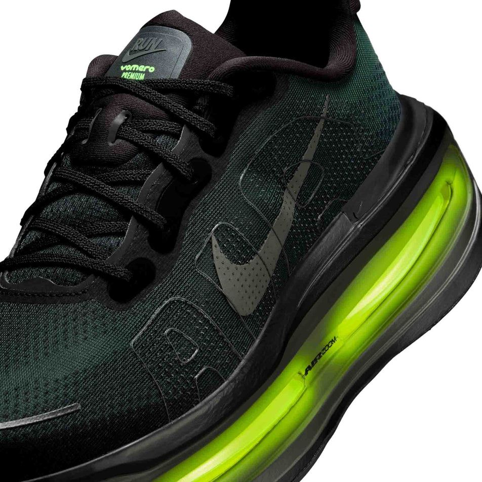 Close-up view of the upper of the left shoe from a pair of Nike Men's Vomero Premium Running Shoes in the Black/Iron Grey-Anthracite-Volt colourway.