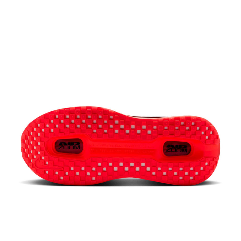 The outsole of the right shoe from a pair of Nike Men's Vomero Premium Road Running Shoes in the Black/Black-Bright Crimson colourway.