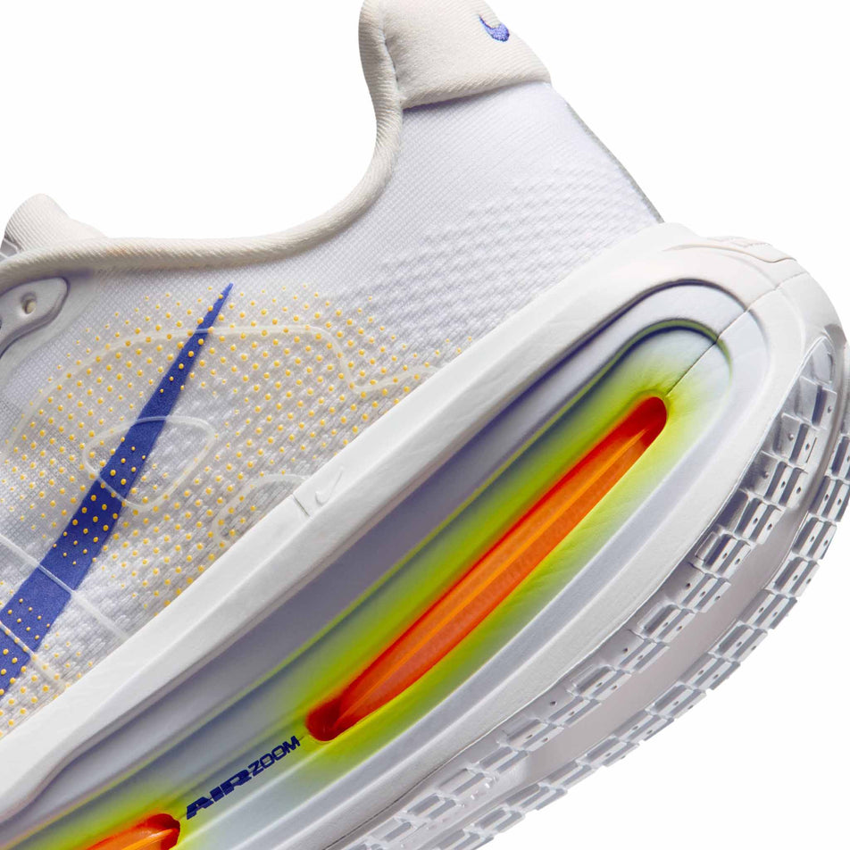 Close-up view of the rearfoot section of the left shoe from a pair of Nike Men's Vomero Premium Road Running Shoes in the White/Lapis-Total Orange-Laser Orange colourway.