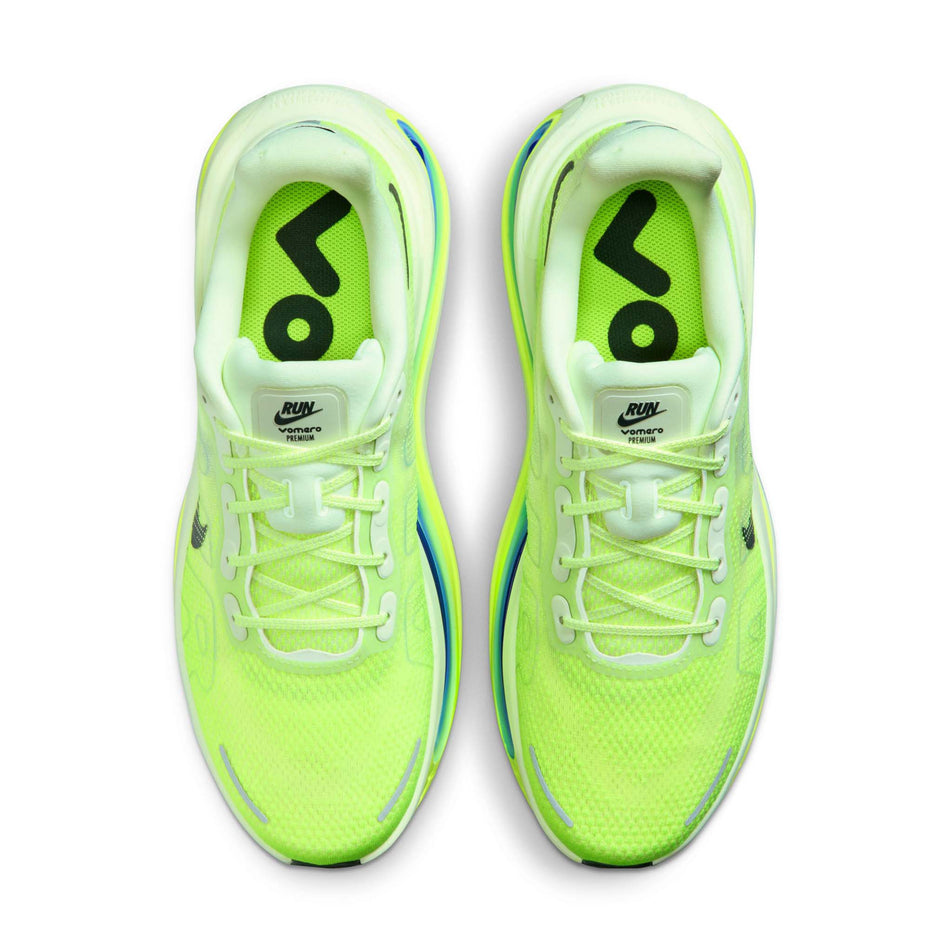 The uppers of a pair of Nike Men's Vomero Premium Road Running Shoes in the Volt Tint/Black Spruce-Sapphire-Volt colourway.