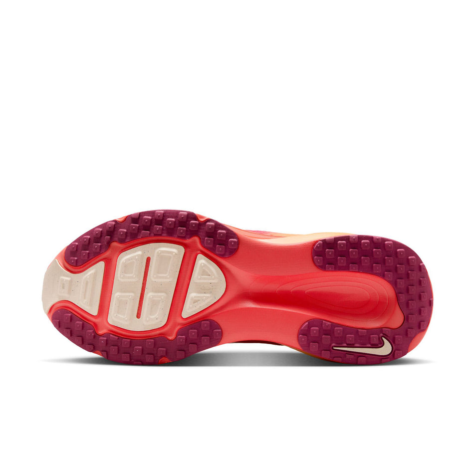 The outsole of the left shoe from a pair of Nike Women's Vomero 18 SE Road Running Shoes in the Ember Glow/Washed Coral-Sweet Beet colourway. (8725394751650)