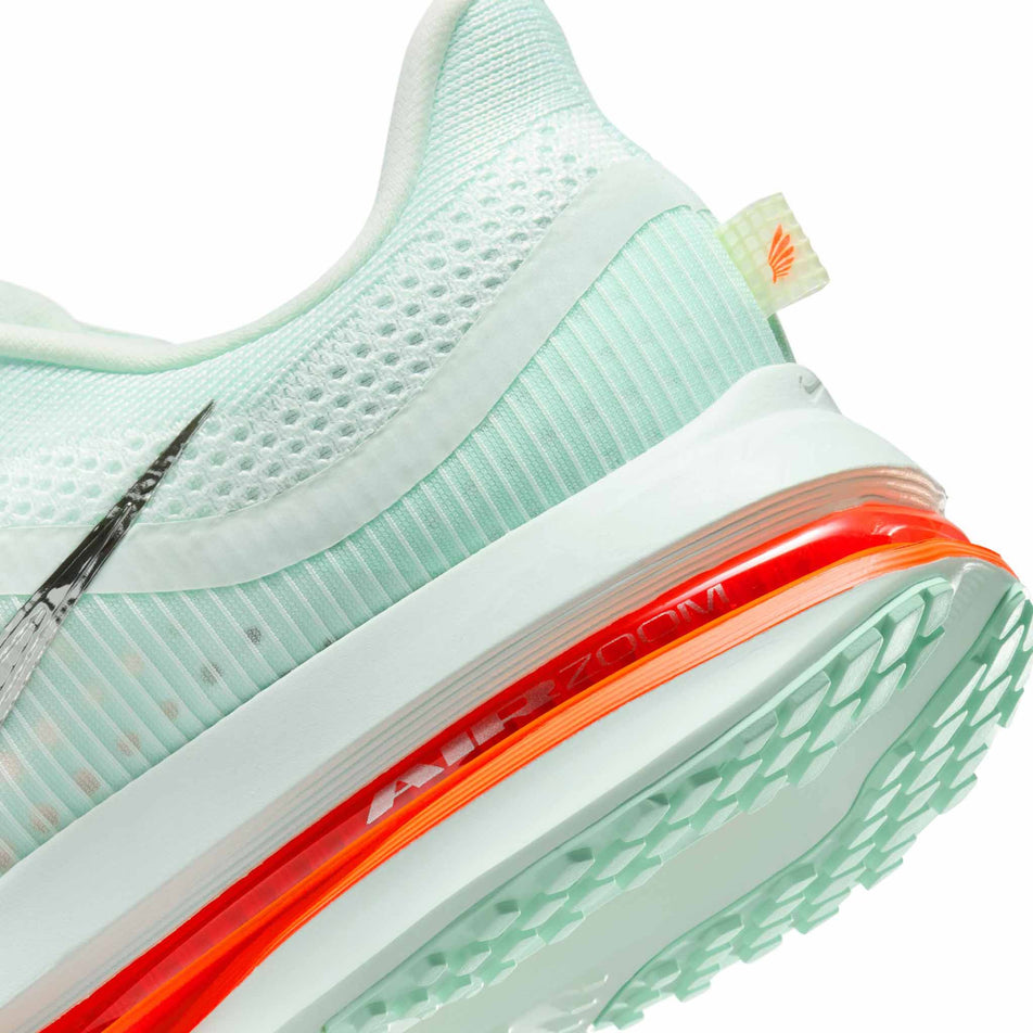 Close up of the midsole of the left shoe from a pair of Nike Men's Pegasus Premium Road Running Shoes in the Barely Green/Bright Crimson-Mint Foam colourway. (8683294982306)