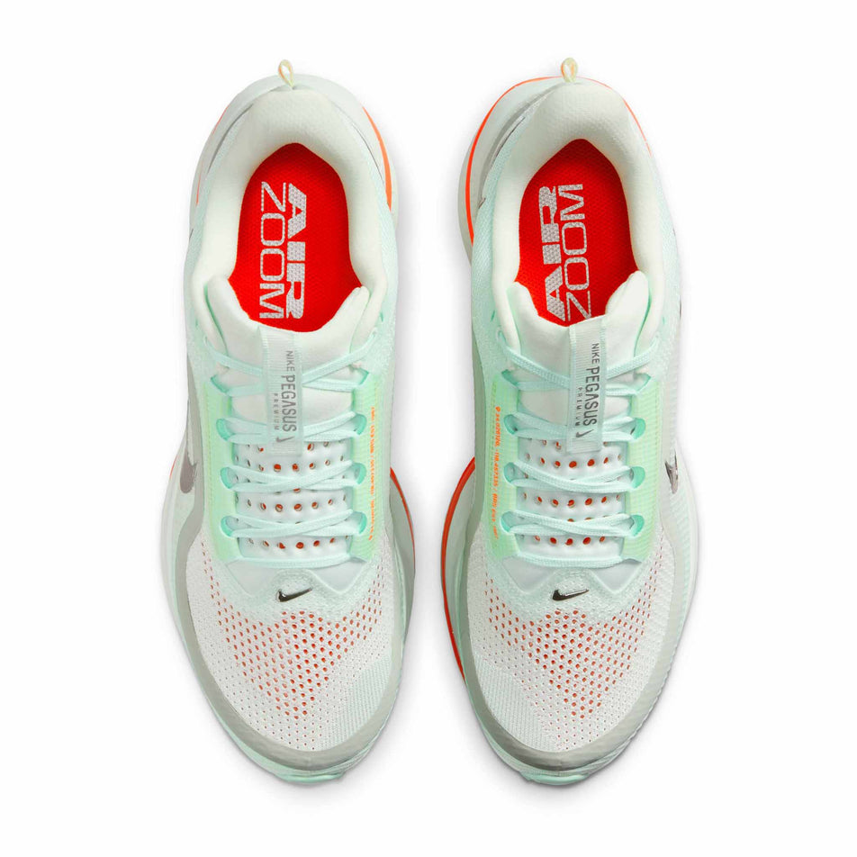 The uppers of a pair of Nike Men's Pegasus Premium Road Running Shoes in the Barely Green/Bright Crimson-Mint Foam colourway. (8683294982306)
