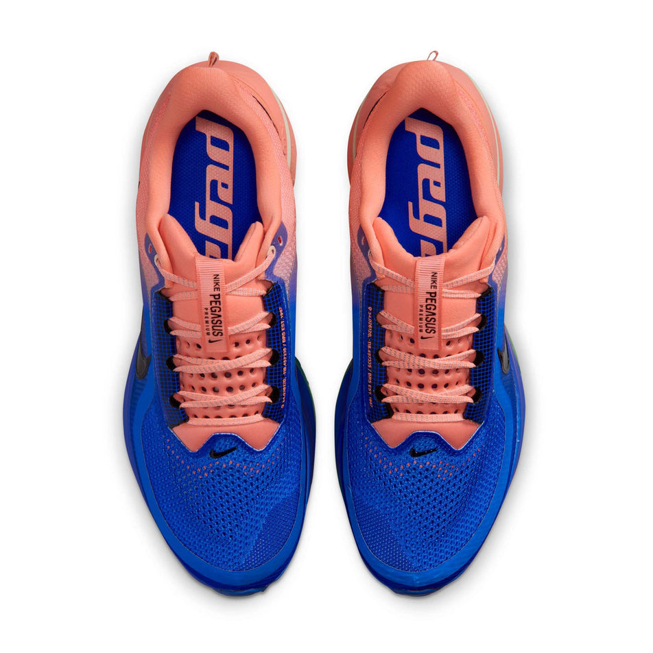 The uppers of a pair of Nike Men's Pegasus Premium Road Running Shoes in the Racer Blue/Black-Atomic Pink-Volt Tint colourway.