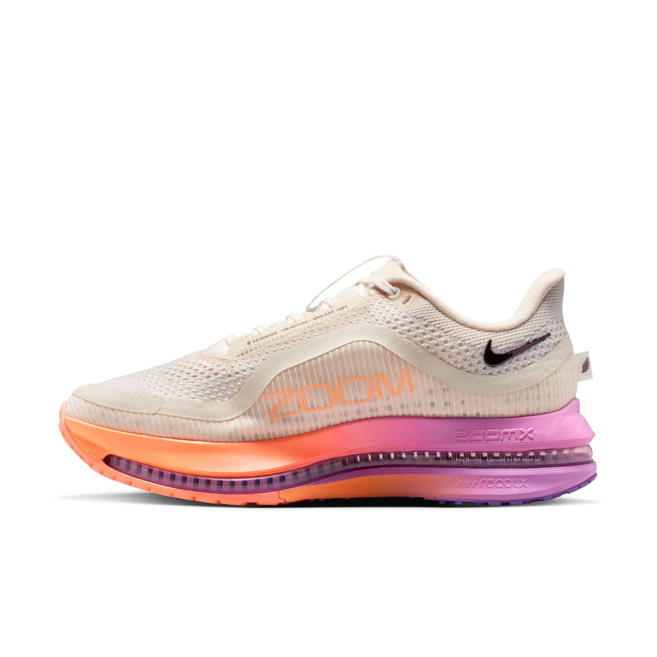 Medial view of the right shoe from a pair of Nike Women's Pegasus Premium Road Running Shoes in the Chalk/Tattoo-Orange Pulse-Light Magenta colourway.