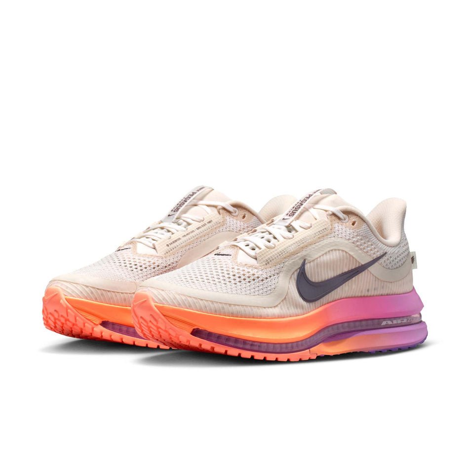 A pair of Nike Women's Pegasus Premium Road Running Shoes in the Chalk/Tattoo-Orange Pulse-Light Magenta colourway.