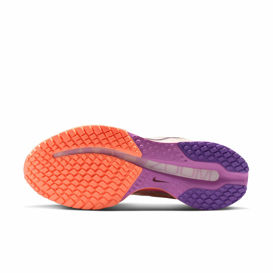 The outsole of the left shoe from a pair of Nike Women's Pegasus Premium Road Running Shoes in the Chalk/Tattoo-Orange Pulse-Light Magenta colourway.