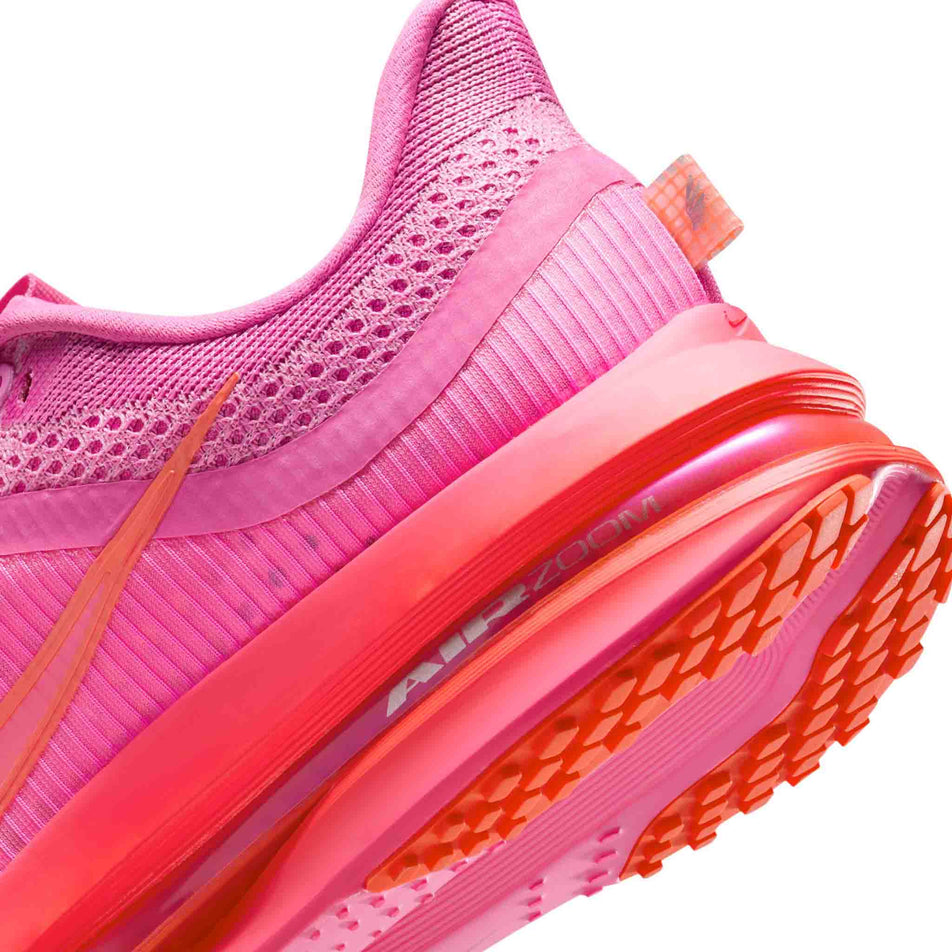 Close up of the midsole of the left shoe from a pair of Nike Women's Pegasus Premium Road Running Shoes in the Playful Pink/Bright Crimson-Hyper Pink colourway. (8684696371362)