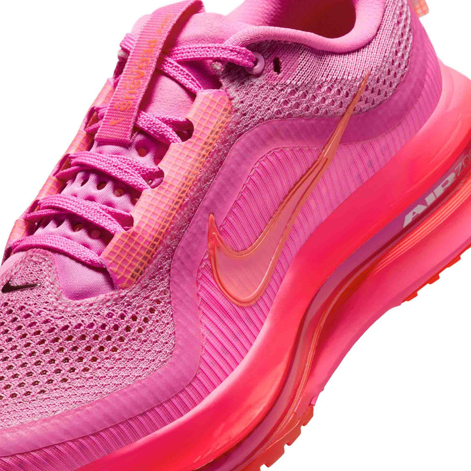 Close up of the upper of the left shoe from a pair of Nike Women's Pegasus Premium Road Running Shoes in the Playful Pink/Bright Crimson-Hyper Pink colourway. (8684696371362)