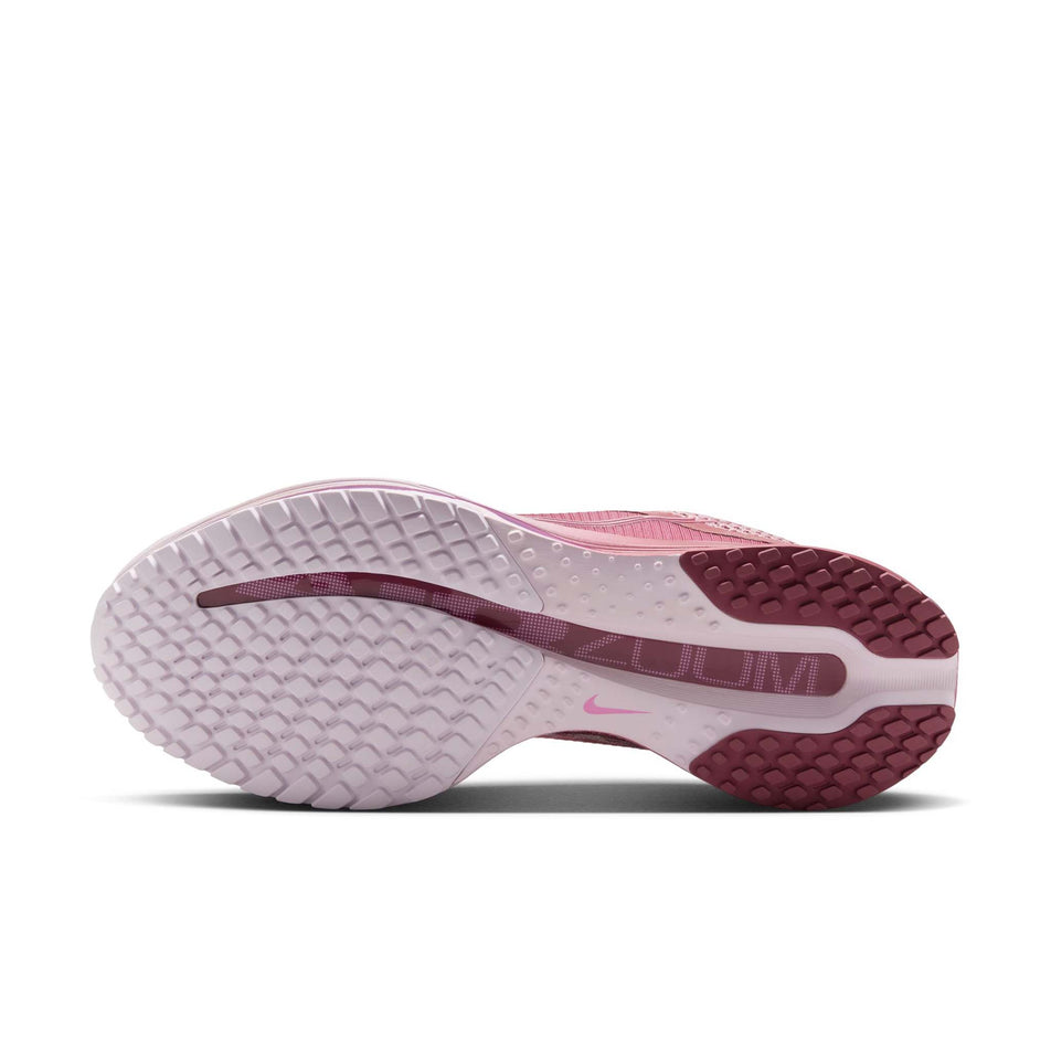 The outsole of the left shoe from a pair of Nike Women's Pegasus Premium Road Running Shoes in the Pink Smoke/Pink Smoke-Light Magenta colourway.