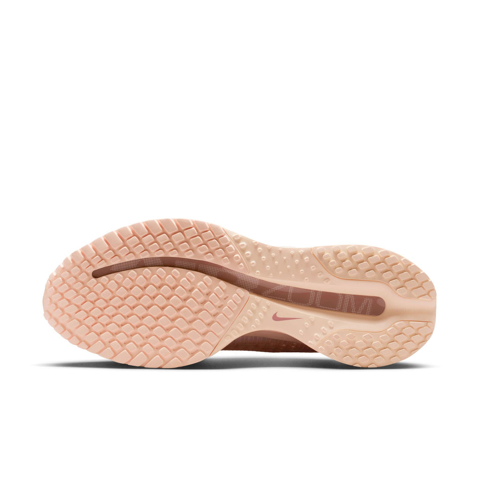 The outsole of the left shoe from a pair of Nike Women's Pegasus Premium Road Running Shoes in the Guava Ice/Sail-Particle Pink colourway.