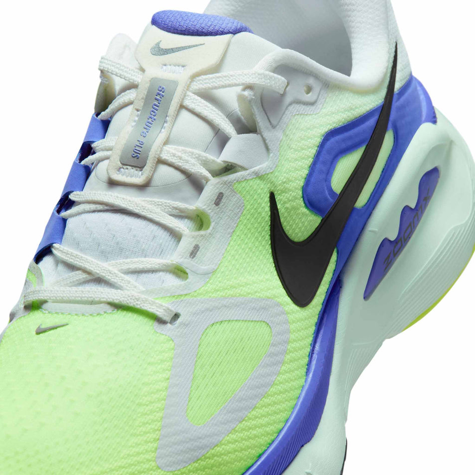 Close-up view of the upper of the left shoe from a pair of Nike Men's Structure Plus Road Running Shoes in the White/Black Spruce-Volt Ice-Barely Green colourway.