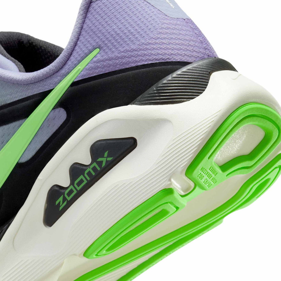 Close-up view of the rearfoot section of the left shoe from a pair of Nike Men's Structure Plus Road Running Shoes in the Iron Purple/Voltage Green-Off Noir-Sail colourway.