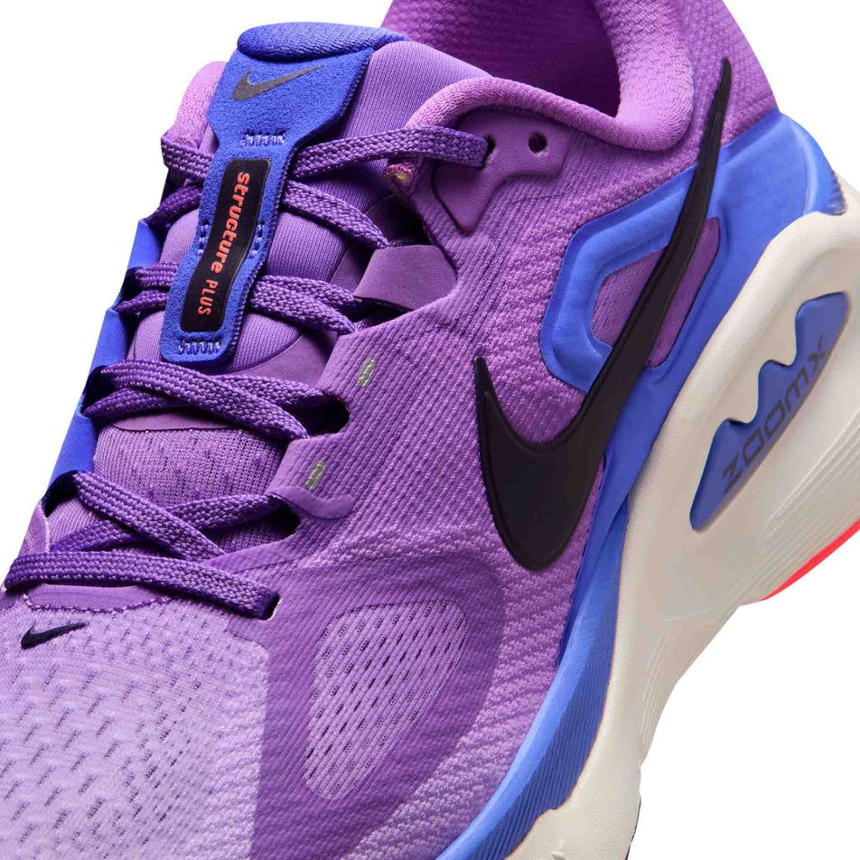 Close-up view of the upper of the left shoe from a pair of Nike Women's Structure Plus Road Running Shoes in the Bright Violet/Purple Dynasty-Violet Mist colourway.