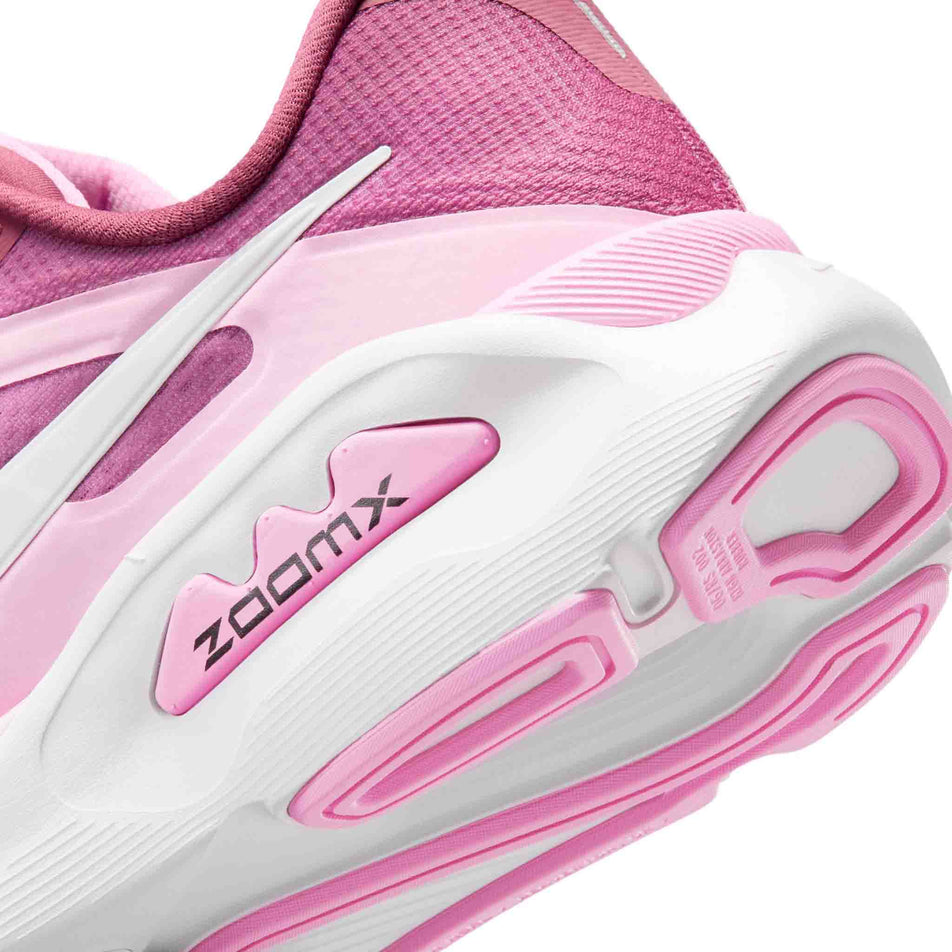 Close-up view of the rearfoot section of the left shoe from a pair of Nike Women's Structure Plus Road Running Shoes in the Pink Smoke/White-Pink Rise-Light Magenta colourway.