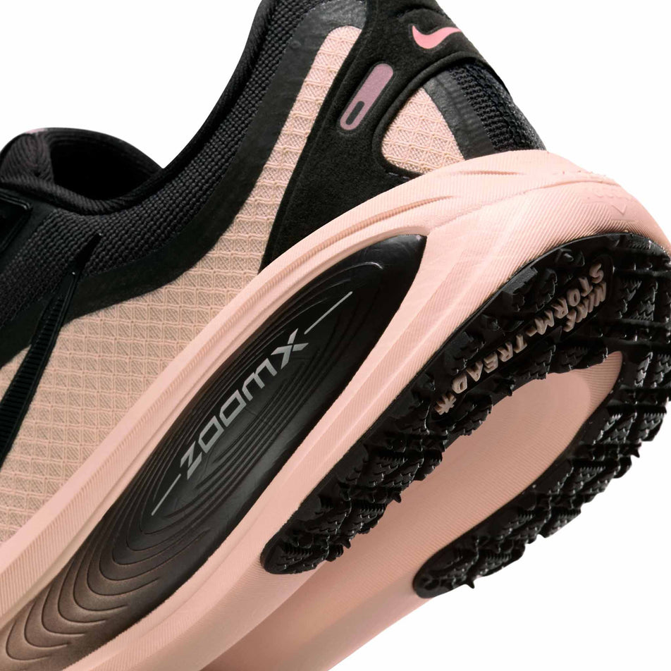 Close-up view of the midsole - outsole - of the left shoe from a pair of Nike Women's Vomero 18 GORE-TEX Road Running Shoes in the Black/Black-Crimson Tint-Black colourway. (8756162494626)