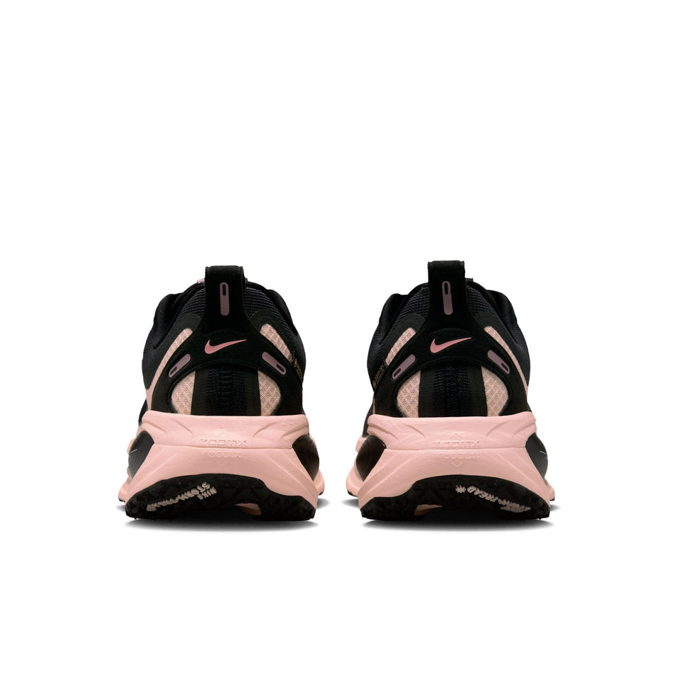 The back of a pair of Nike Women's Vomero 18 GORE-TEX Road Running Shoes in the Black/Black-Crimson Tint-Black colourway. (8756162494626)