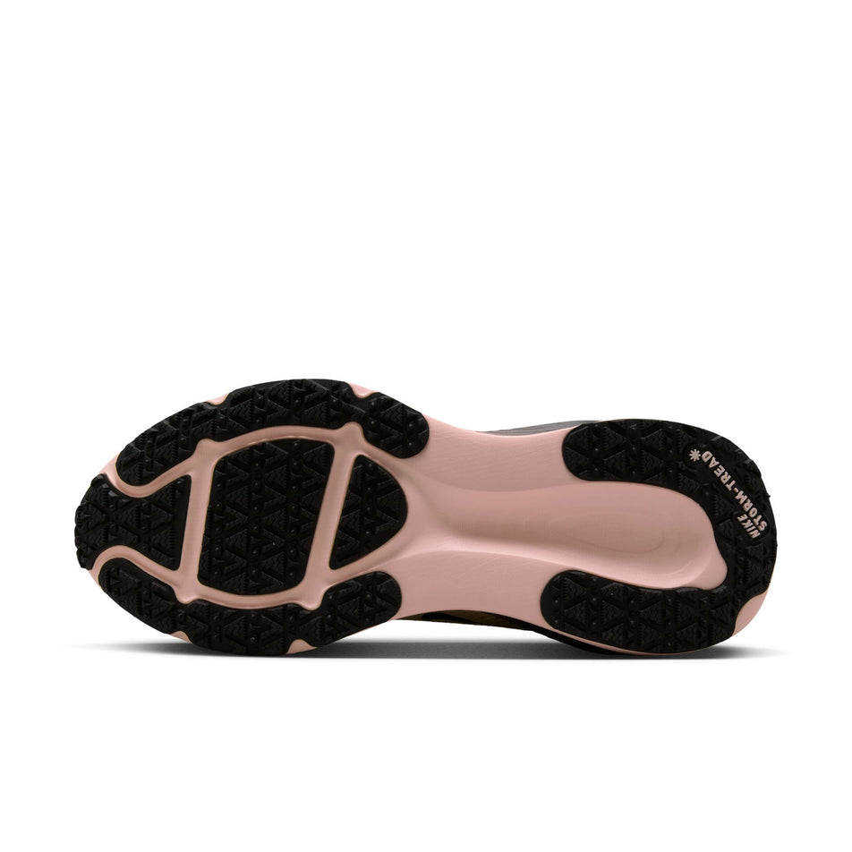 The outsole of the left shoe from a pair of Nike Women's Vomero 18 GORE-TEX Road Running Shoes in the Black/Black-Crimson Tint-Black colourway. (8756162494626)