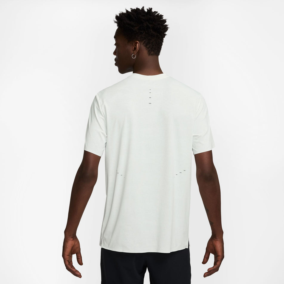 Back view of a model wearing the Nike Men's Dri-FIT ADV Run Pinnacle Short-Sleeve Running Top in the Summit White/Blkref colourway. (8710821314722)