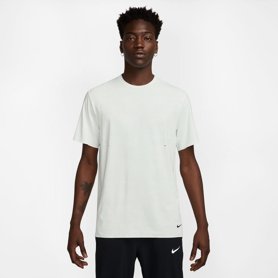 Front view of a model wearing the Nike Men's Dri-FIT ADV Run Pinnacle Short-Sleeve Running Top in the Summit White/Blkref colourway. (8710821314722)