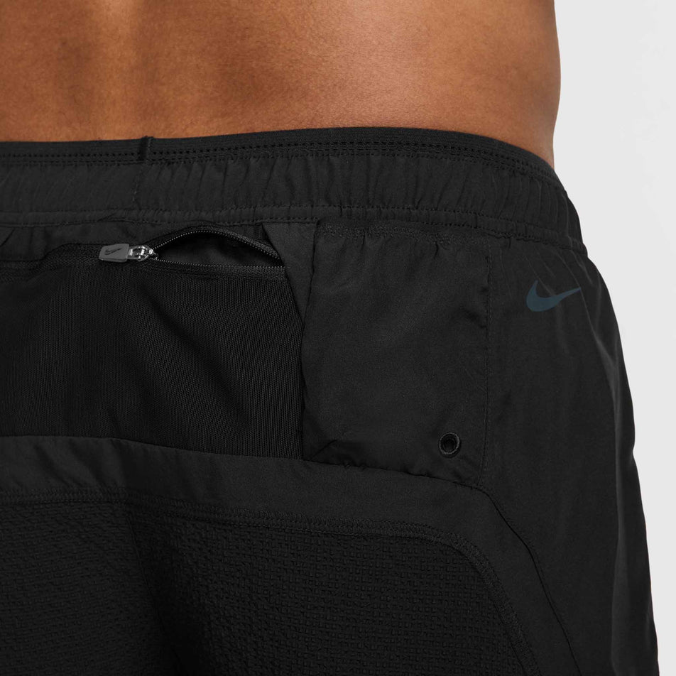 Close up of the zip pocket on the back of the Nike  Men's Dri-FIT ADV 5