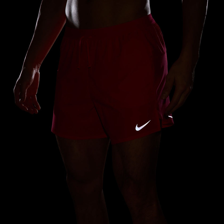 The reflective Nike Swoosh on the front of the Nike Men's Stride Dri-FIT 5
