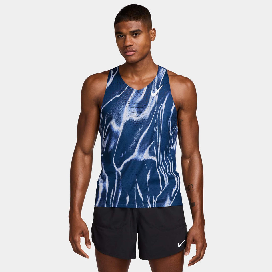 Front view of a model wearing the Nike Men's AeroSwift Dri-FIT ADV Running Singlet in the Coastal Blue/White colourway. (8710427803810)