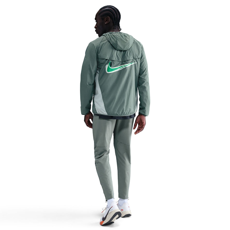 Front view of a model wearing the Nike Men's Stride