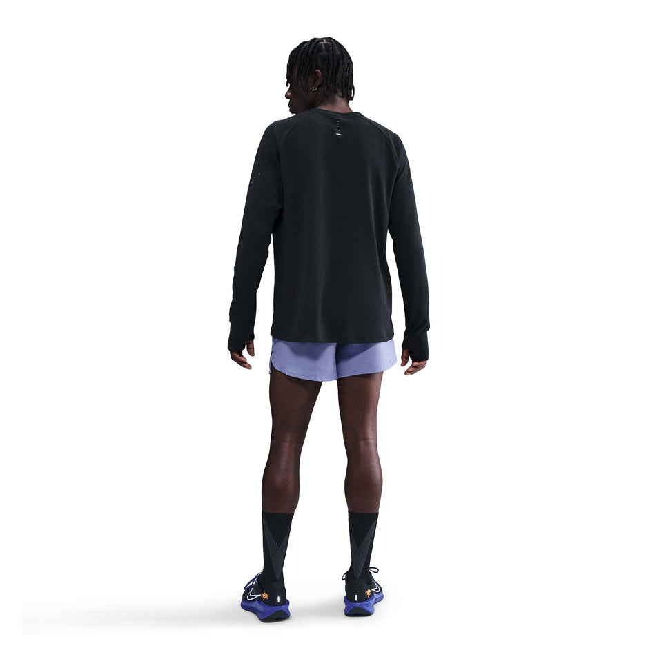Back view of a model wearing the Nike Men's Dri-FIT Stride Running Waffle Crew in the Black/Reflective Silver colourway. (8733246980258)