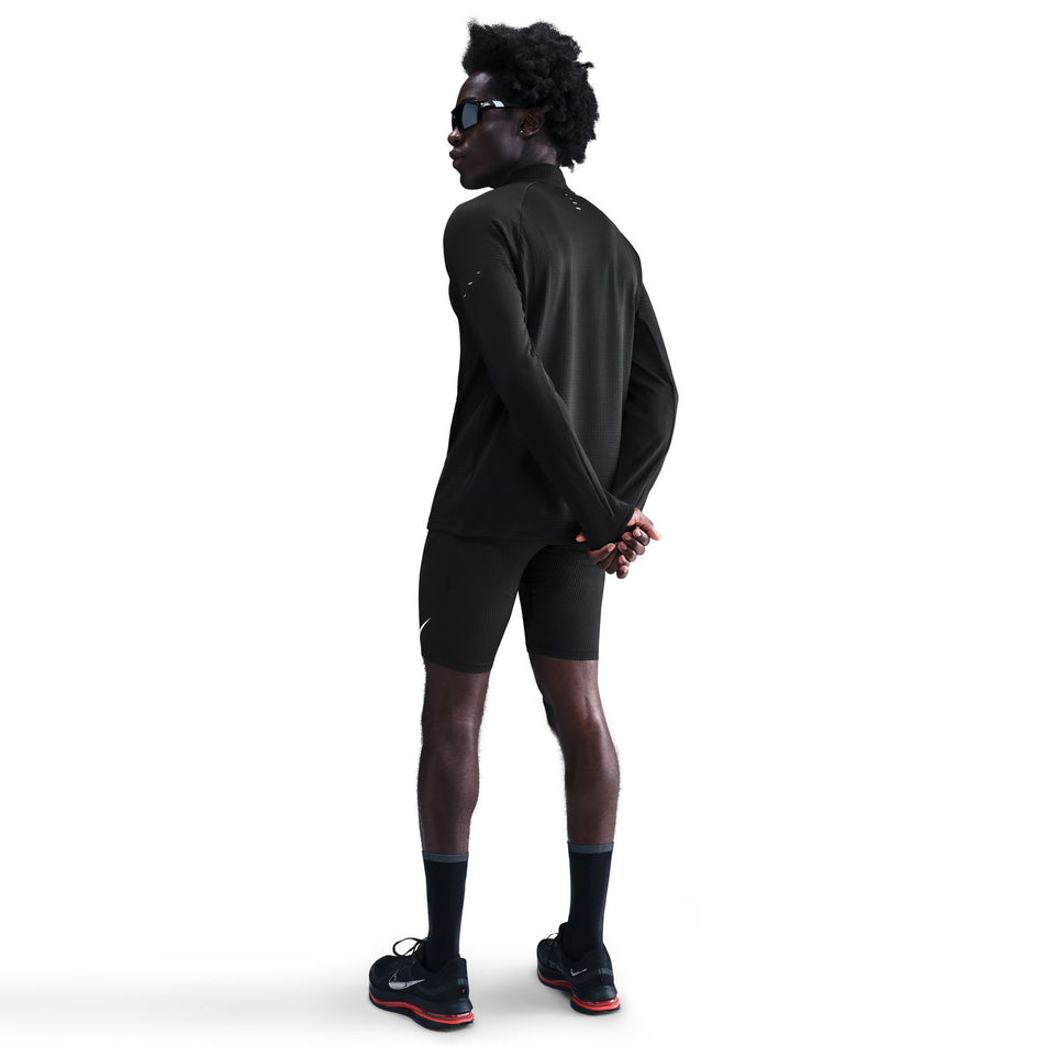 Back view of the Nike Men's Stride Therma-FIT Repel Winterized 1/2-Zip Running Top in the Black/Reflective Silver colourway. (8778200383650)