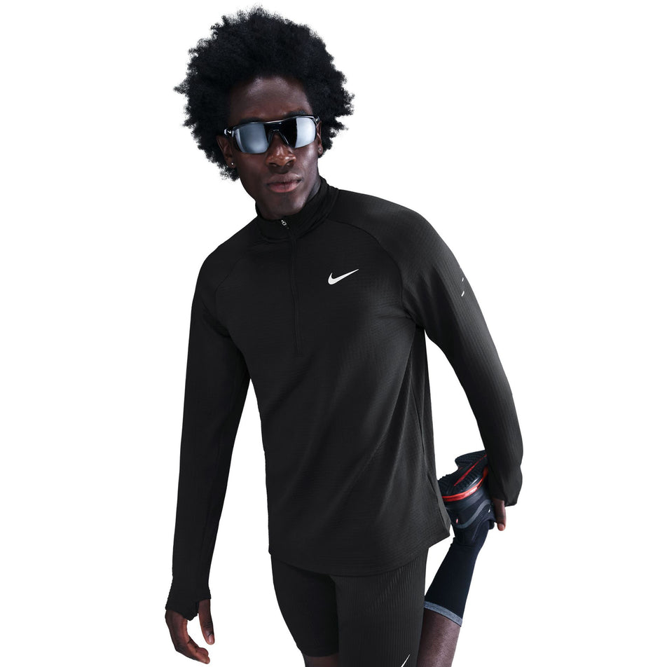 Front view of the Nike Men's Stride Therma-FIT Repel Winterized 1/2-Zip Running Top in the Black/Reflective Silver colourway. (8778200383650)