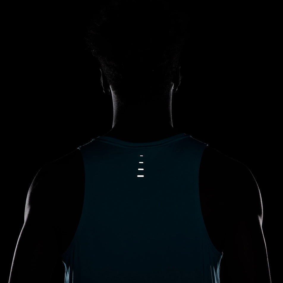 The reflective graphics on the back of the Nike Men's Stride Dri-FIT ADV Running Tank Top in the Dusty Cactus/Reflective Silver colourway. (8563458703522)