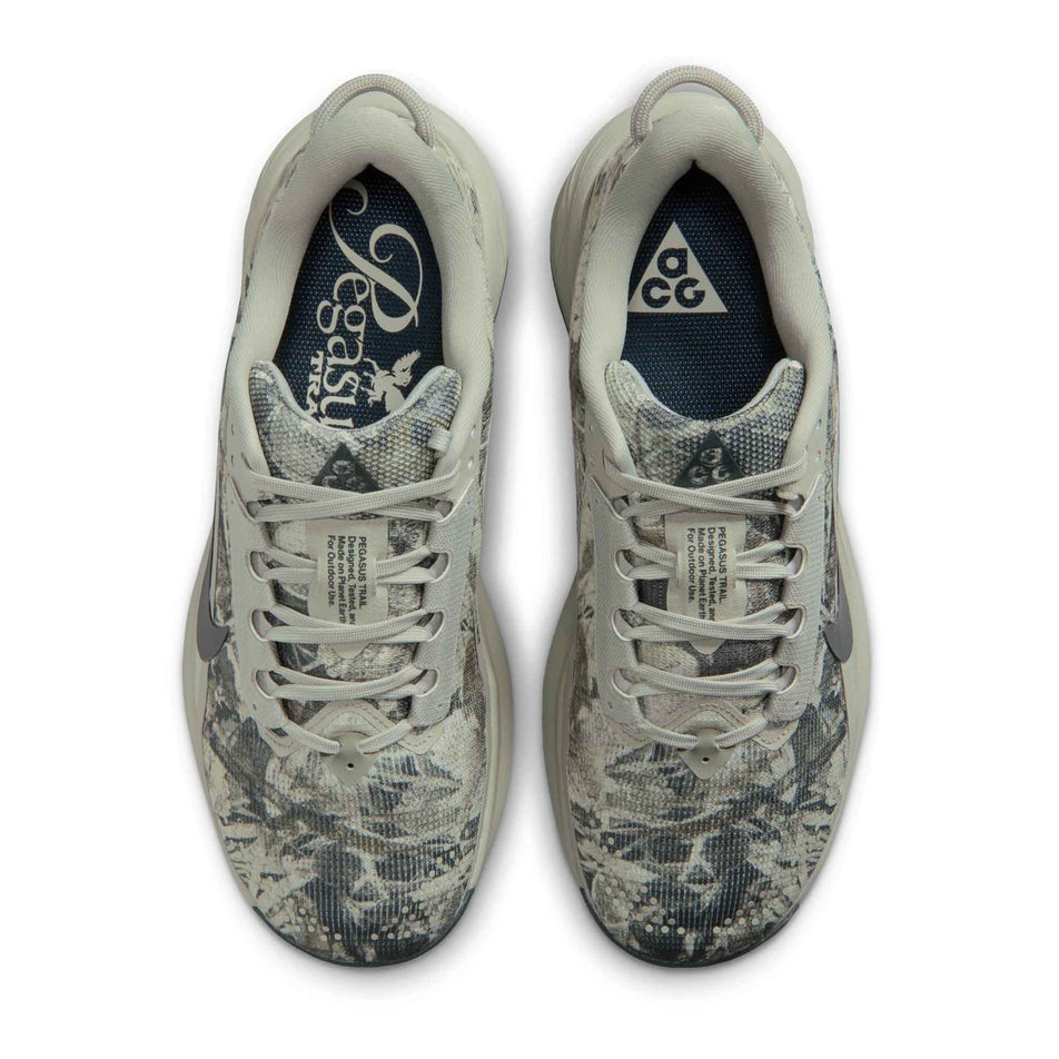 The uppers of a pair of Nike Women's ACG Pegasus Trail Running Shoes in the Spruce Fog/Black Spruce-Sea Glass colourway.