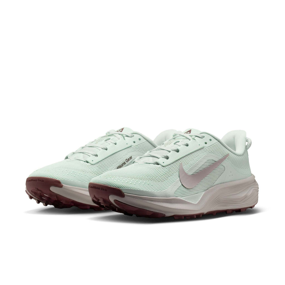A pair of Nike Women's ACG Pegasus Trail Running Shoes in the Barely Green/Silver Lilac-Light Bone colourway.