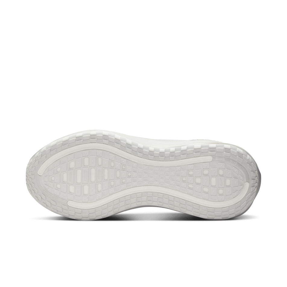 The outsole of the left shoe from a pair of Nike Men's Vomero Plus Road Running Shoes in the White/Summit White-Photon Dust colourway. (8723689111714)