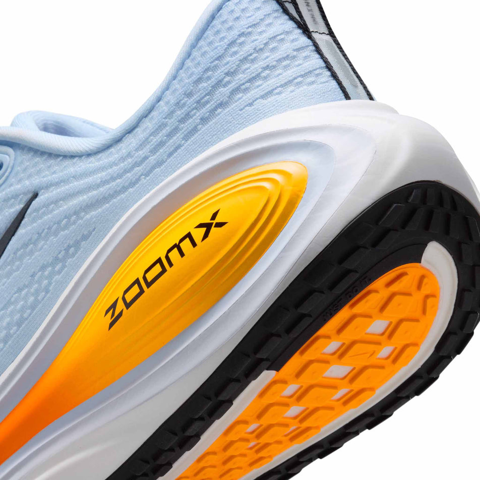 Close-up view of the rearfoot section of the left shoe from a pair of Nike Men's Vomero Plus Road Running Shoes in the Hydrogen Blue/Black-White-Total Orange colourway.