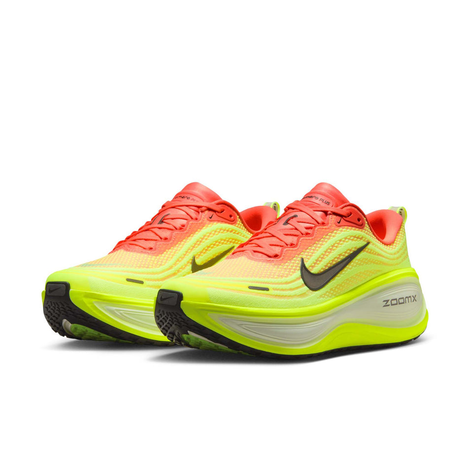 A pair of Nike Men's Vomero Plus Road Running Shoes in the Bright Mango/Metallic Dark Grey Volt colourway. (8723707166882)