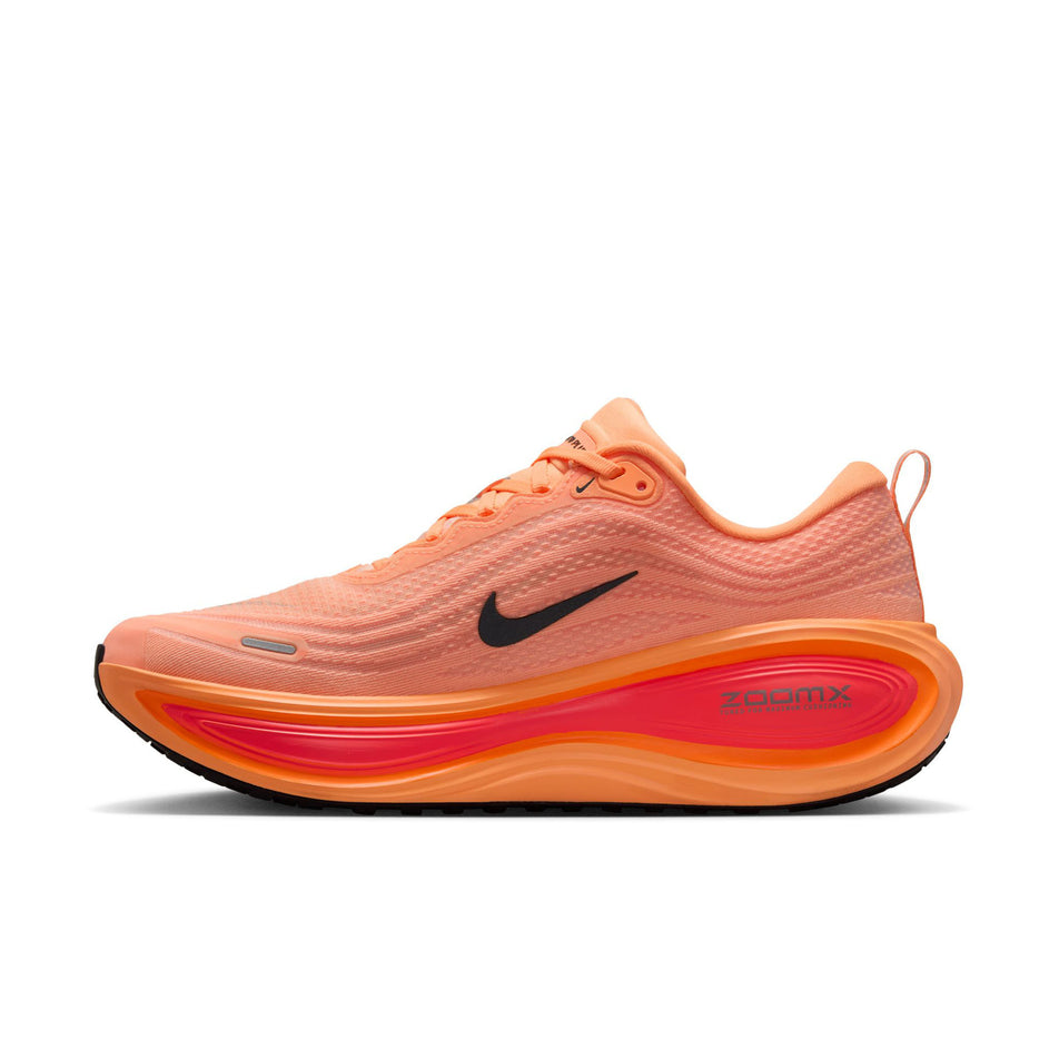 Medial view of the right shoe from a pair of Nike Men's Vomero Plus Road Running Shoes in the Orange Pulse/Black-Hot Lava-Total Orange-Orange Chalk-Metallic Dark Grey colourway. (8725442330786)