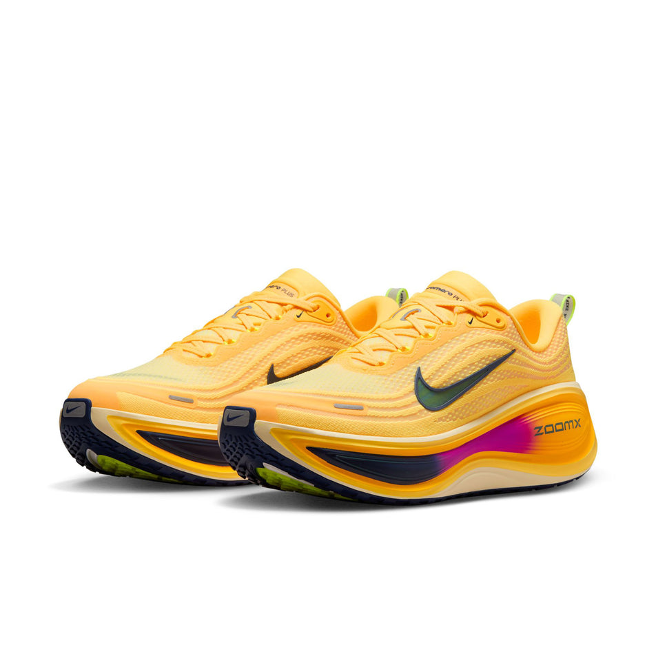 A pair of Nike Men's Vomero Plus Road Running Shoes in the Citron Pulse/Blue Void-Alabaster colourway.