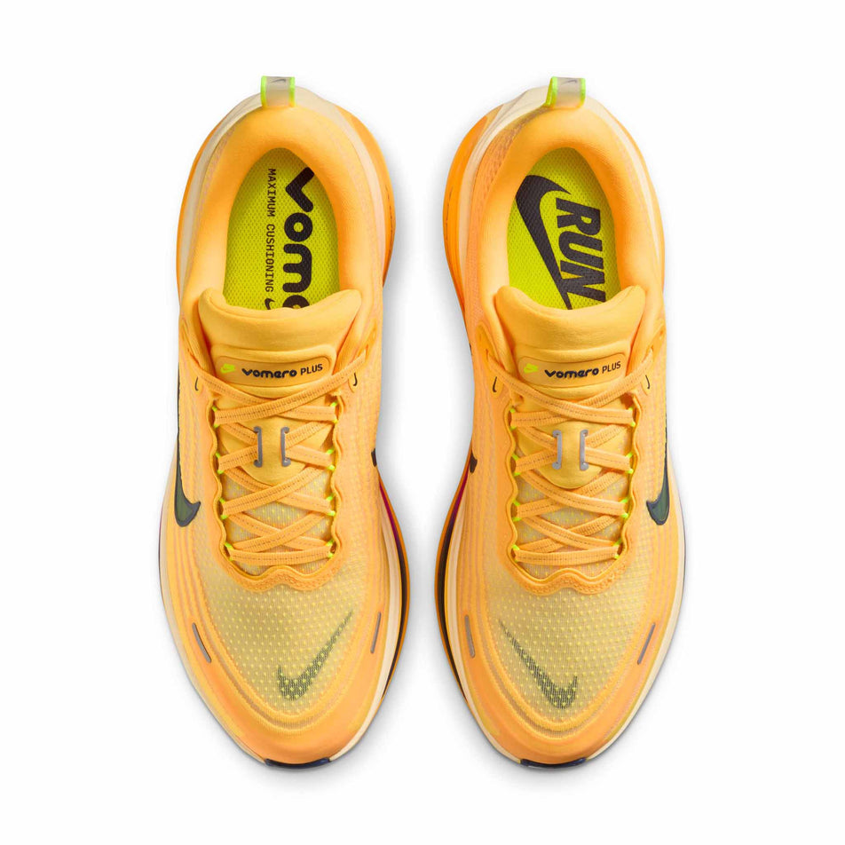 The uppers of a pair of Nike Men's Vomero Plus Road Running Shoes in the Citron Pulse/Blue Void-Alabaster colourway.