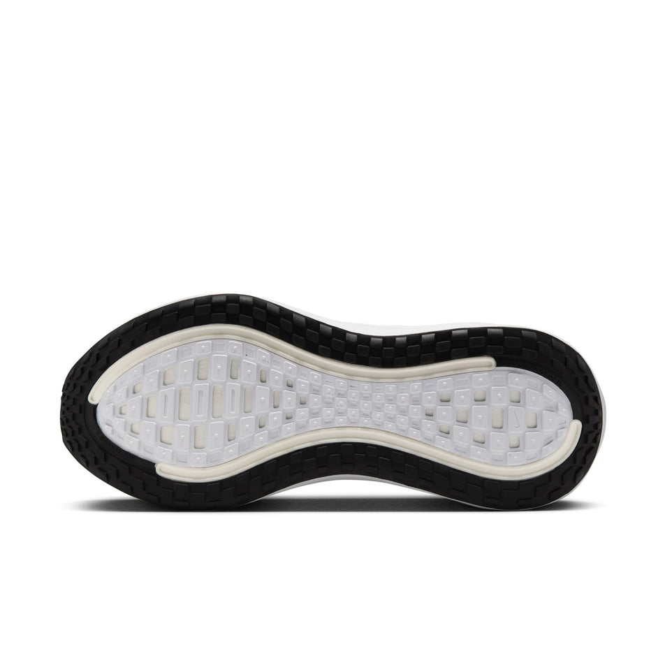 The outsole of the left shoe from a pair of Nike Women's Vomero Plus Road Running Shoes in the Black/White-Cool Grey Metallic Dark Grey colourway. (8725322170530)