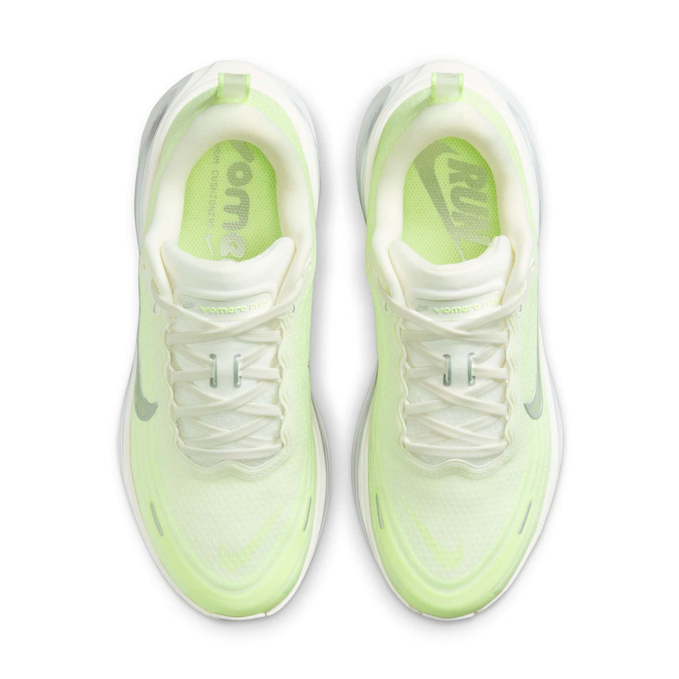 The uppers of a pair of Nike Women's Vomero Plus Road Running Shoes in the Sail/Metallic Silver-Barely Volt colourway. (8725325480098)
