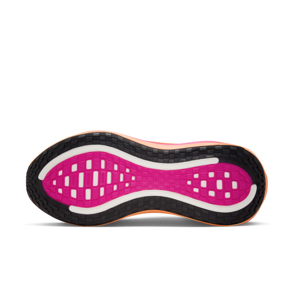The outsole of the left shoe from a pair of Nike Women's Vomero Plus Road Running Shoes in the White/Black-Fire Pink-Hyper Crimson colourway. (8756160888994)