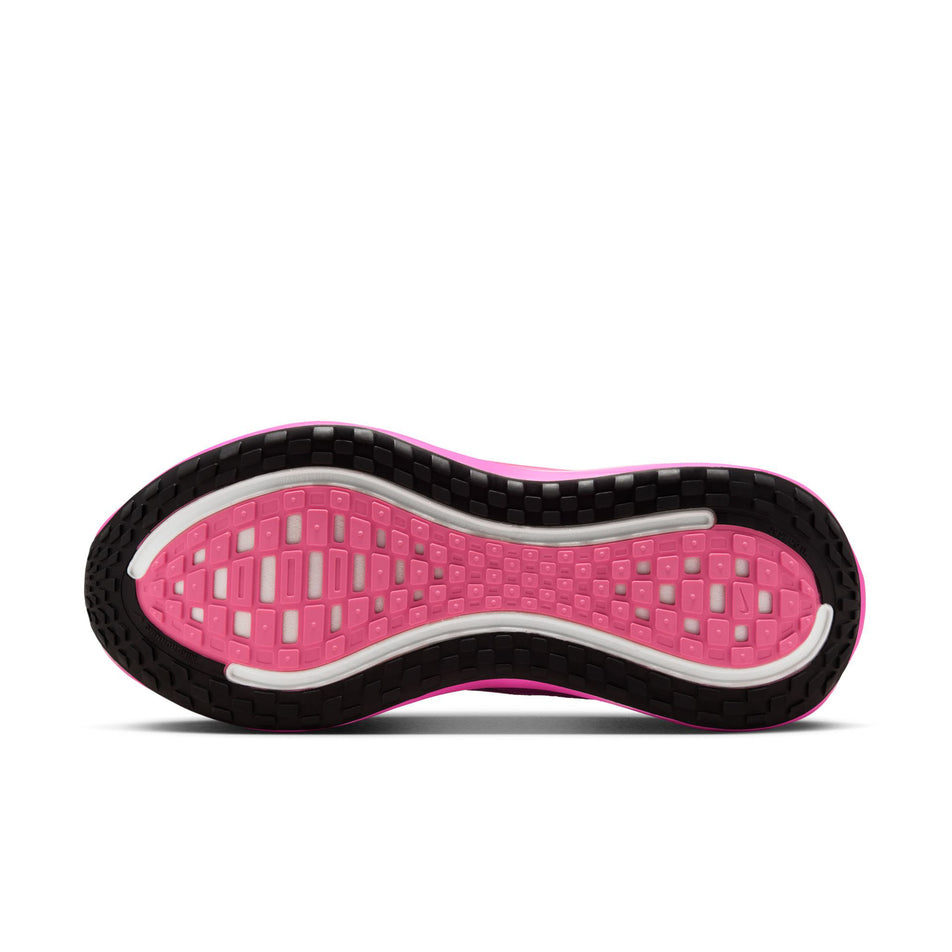 The outsole of the left shoe from a pair of Nike Women's Vomero Plus Road Running Shoes in the Royal Pulse/Metallic Dark Grey-Fire Pink colourway. (8725329608866)