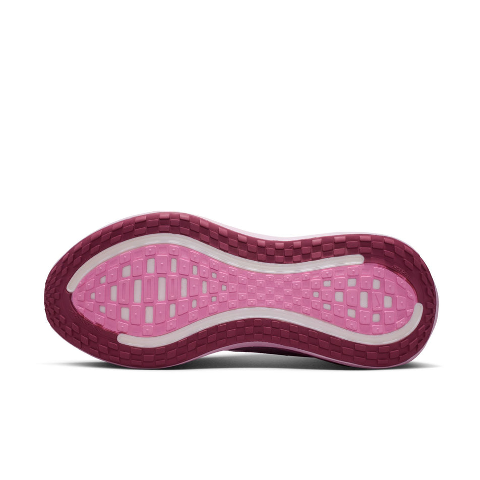 The outsole of the left shoe from a pair of Nike Women's Vomero Plus Road Running Shoes in the Bleached Lilac/Light Magenta-Pink Rise colourway.