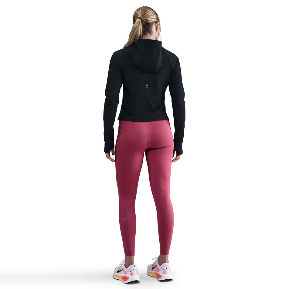 Back view of a model wearing the Nike Women's Swift Therma-FIT Running Jacket in the Black/Reflective Silver colourway.