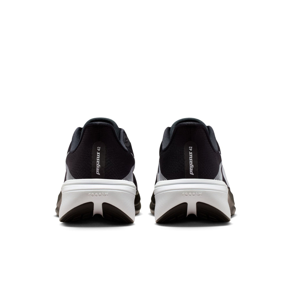 The back of a pair of Nike Men's Pegasus 42 Road Running Shoes in the Black/White-Photon Dust colourway.