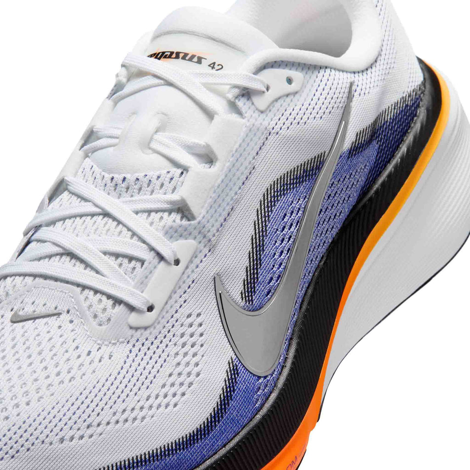 Close-up view of the upper of the left shoe from a pair of Nike Men's Pegasus 42 Road Running Shoes in the White/Metallic Silver-Lapis-Total Orange colourway.